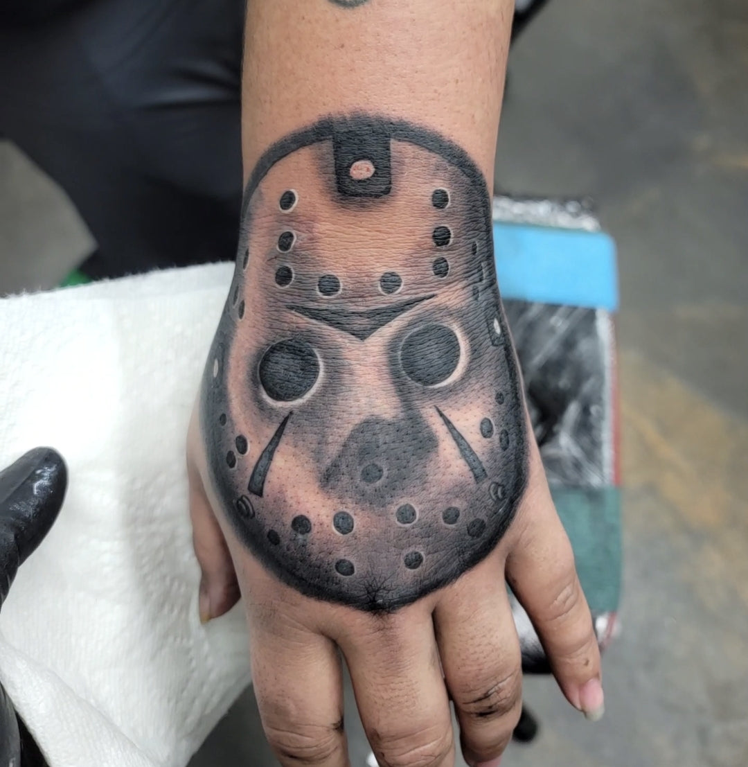 Top Hand Tattoo